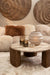 Beige polyester vloerkleed Curvae 109x238 cm in een sfeervol interieur met een marmeren salontafel en zachte texturen.