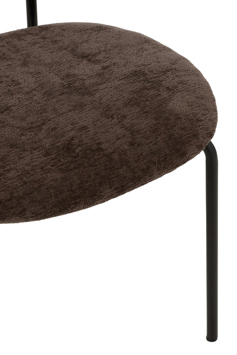 Bruine eetkamerstoel met zachte textiel zitting en slank zwart metalen frame.