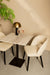 Vierkante PTMD eettafel Plaza van 70 cm met wit marmeren blad en zwart onderstel, inclusief twee beige stoelen.