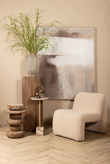 Moderne beige fauteuil Oslo van PTMD met zachte polyester bekleding in een stijlvol interieur.