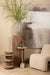 Beige polyester fauteuil Oslo van PTMD met een moderne, zachte textuur in een sfeervol interieur.