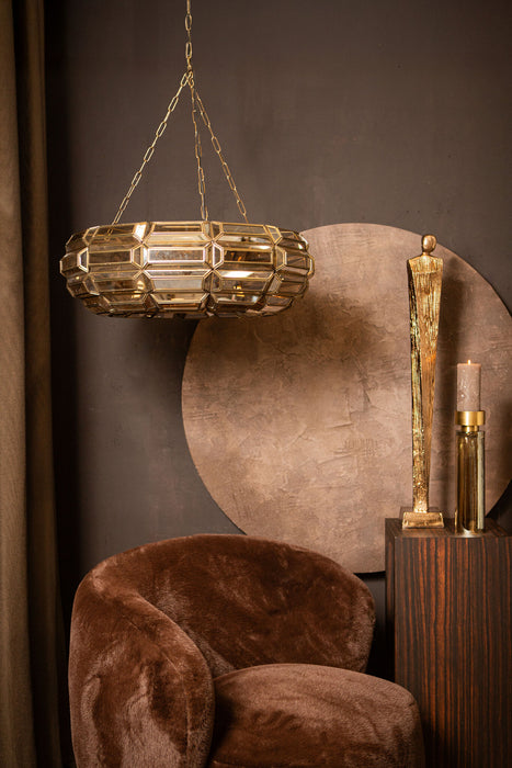 Goudkleurige PTMD hanglamp van glas met een geometrisch design, afmeting 70x70x21 cm, hangend in een stijlvol interieur.