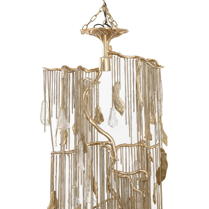 PTMD Wilco hanglamp van 98 cm in messingkleurig gegoten aluminium met decoratieve kettingen en organische vormen.