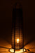 Zwarte vloerlamp van 100 cm hoog met een textielstructuur en sfeervolle warme verlichting.